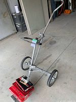 Full view of Kaddy-Lac golf cart with boxes and Cat Eye on top