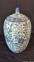 Front view of blue floral ceramic ginger jar with lid