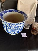 planter front view with clear vase and gold glass pot visible