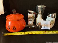 Group shot of all items with measuring tape for scale