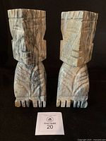 Front view of both stone figurine bookends with size card