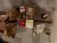 Overview of all items including belt, hardware, compound, tape