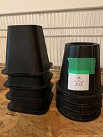 Stacked square and round black bed risers