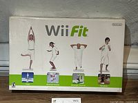 Front of Wii Fit game box showing exercise types yoga, balance games, strength training, aerobics