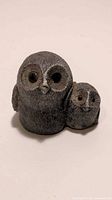 Photo showing front view of the vintage black soapstone mother owl and baby owlet sculptures.