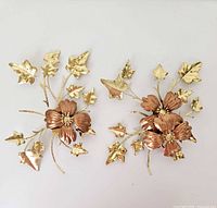 Front view of both wall hangings showing gold leaves and copper dogwood flowers