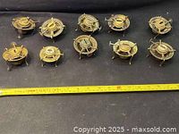 Top-down view showing all 10 burners spaced in two rows with measurement tape showing size.