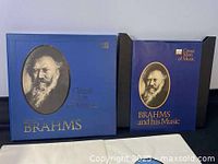 Two vintage Brahms vinyl album boxes with portraits on blue covers