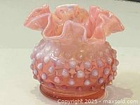 Front view of the small pink Fenton hobnail vase showing the ruffled edge and rounded hobnail bumps on the body.
