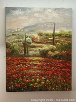 Full view of the landscape oil painting showing vibrant flowers, greenery, and distant hills under a cloudy sky.