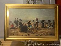 Full view of vintage framed lithograph of beach scene with figures and parasols.