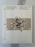 Front cover of 1984 souvenir collection book showing a collage of Canadian stamps and year 1984 in white blocks, bilingual title in English and French.