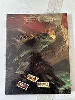 Cover of the 1990 souvenir collection book showing a dinosaur sculpture and several stamps.