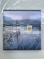 Front cover of the 2001 Canada postage stamps collection book featuring a Canadian landscape image with a highlighted stamp on the cover.