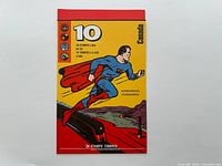 Front cover of booklet showing superhero in flight on yellow background with denomination and Canada branding.