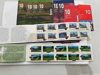 Photo of ten unopened Canadian postage stamp booklets with different thematic covers including golf and maple leaf designs.