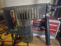 Front and side view of AEG PH 350 hammer with side handle and cord visible