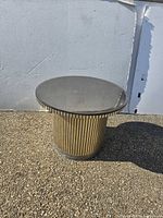 Full view of round accent table outdoors