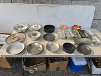 Overview of entire assortment of bakeware laid out on table