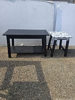 Coffee table and side table showing overall design, finish, patterned top, and wear