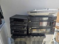 Full stack showing three AIWA and two Sharp stereo components