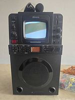 Front view of Memorex MKS8595 karaoke machine with microphone on top
