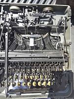 Underside view showing full mechanical linkage and typebars