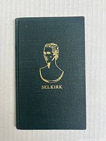 Front cover of the book showing the gold embossed portrait and title 'SELKIRK' on dark green textured background.