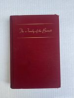 Front cover of the book 'The Family of the Barrett' showing the title in gold lettering on a maroon hardcover with slight wear on edges and corners.