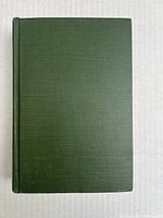 Front cover of the book with a plain green cloth cover