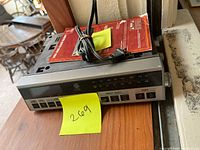 Front view of GE 7-4220 clock radio showing display, buttons, power cord