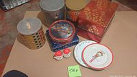 Group shot of all tins, plates and Santa shakers laid out