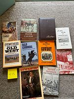 Front covers of nine books arranged in three rows