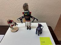 Full view of the three figurines on tabletop