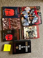 Top-down view showing all seven books to confirm count and visible titles