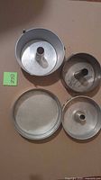 Four pieces: angel food pan, tin-plated springform pan, perforated disc, loose insert