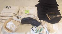 Full lot laid out: white cotton and navy wool uniforms, hats, deck cap, patches, belt