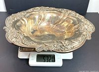 Top angled view of sterling silver bowl on scale showing 532 g
