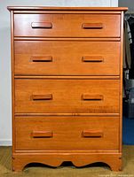 Angled front view of Vilas four-drawer highboy dresser showing wood tone and drawer pulls