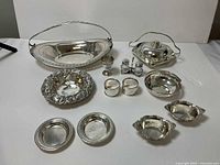 All 12 sterling silver pieces arranged
