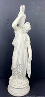 front view of porcelain Venus statue with amphora