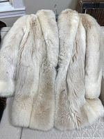 Front view of fox fur coat showing color and length