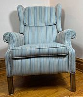 Front view of blue striped wingback recliner
