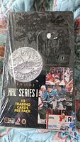 Front view of the sealed box showing the NHL Series 1 logo, images of players and the packaging shrink-wrap.