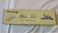 Box labeled Frost Cutlery White Tail Custom Designed Frost Wood Handle.
