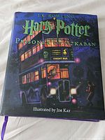 Front cover of the illustrated edition showing Knight Bus artwork and book title