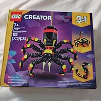 Front of the LEGO Creator Surprising Spider 3-in-1 set box showing age recommendation, piece count, and main spider model image.