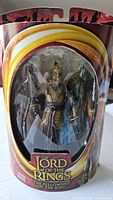 Front view of sealed Elven Warrior action figure in original The Lord of the Rings packaging showing figure and accessories.