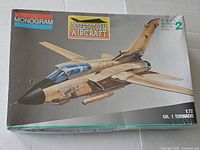 Front box view showing aircraft artwork and Monogram branding.