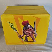 Yellow rectangular box with Pudgy Pig character holding a sword and scepter on one side